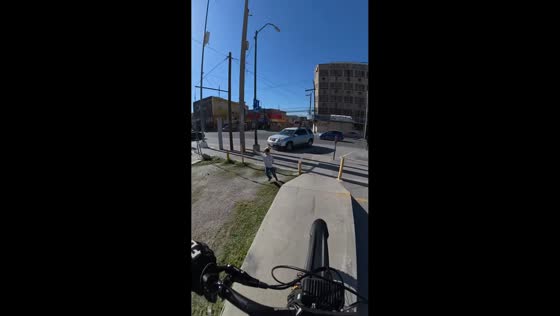 Mother stops child from running into bike path in Ciudad Juárez, Mexic