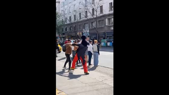 Mickey mouse mascot fights with another person in Córdoba street