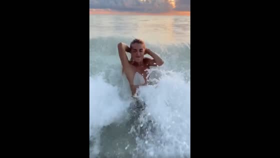Girl gets slammed by a massive wave.