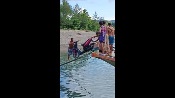 Motorcycle falls into sea while unloading in Divilacan, Isabela, Philippines