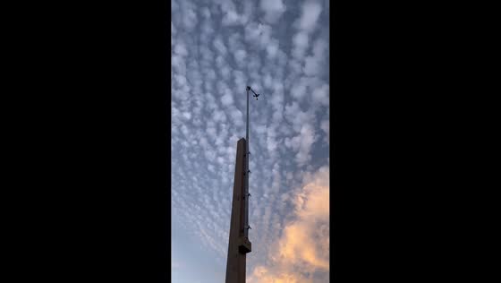 Altocumulus clouds at sunrise over weather station in Lake Worth, USA