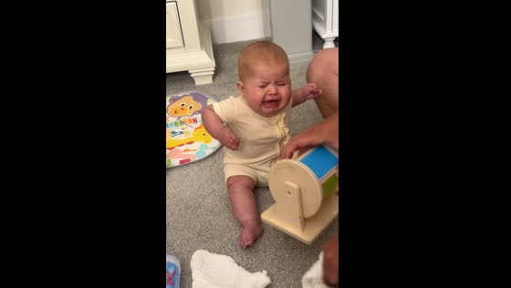 Child pinches fingers on rotating wheel after burping