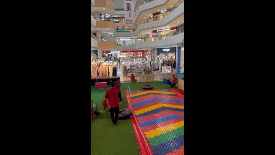 Person skates on donut-like object and falls in Cilegon, Indonesia