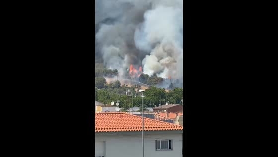 Large wildfire sends towering smoke over Sentmenat in Catalonia, Spain