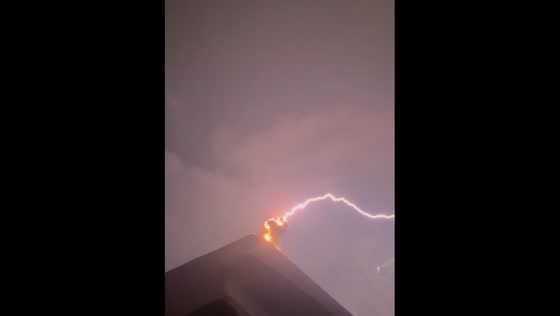 Fuego volcano erupts amidst lightning storm