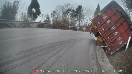 Truck overturns on mountain road in China after avoiding collision with a van