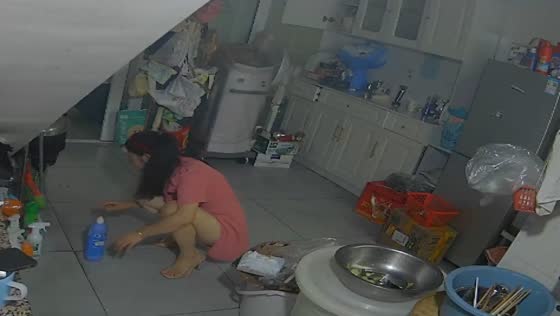 Woman gets startled when a mouse suddenly darts out in Yibin, China