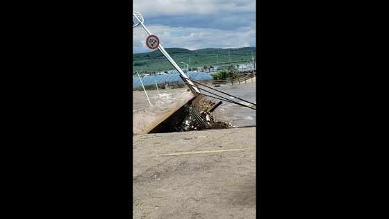 Floodwaters wash away road bridge in Heilongjiang, China
