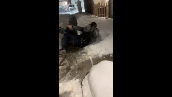 Man startled by a fart slips in the snow in Dayton, Ohio, USA