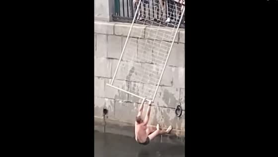 Unfortunate swimmer saved from canal by passers-by using metal fence