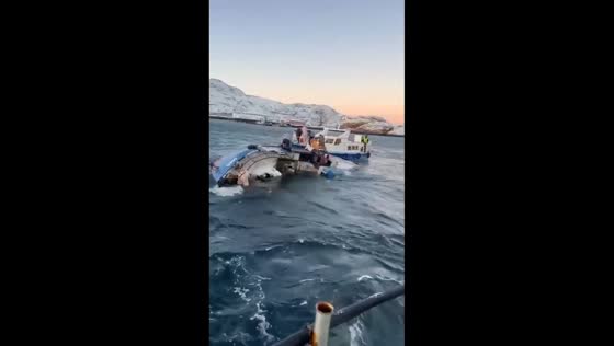 Small vessel sinks in icy Sea in Teriberka, Murmansk, Russia