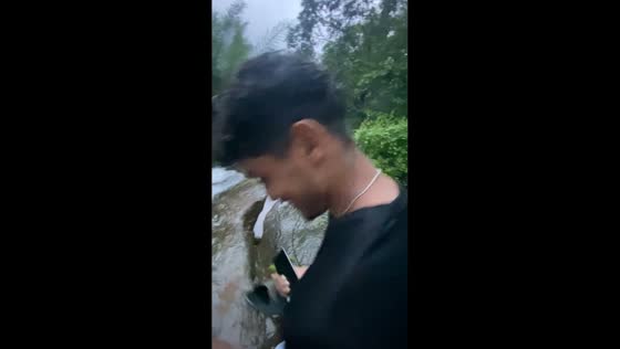 Man slips into river on slippery rocks in Malappuram, Kerala, India
