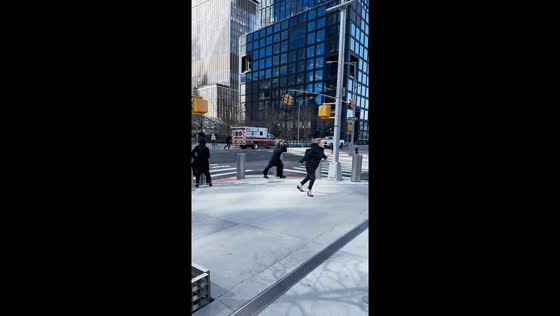 Strong winds buffet pedestrians in Hudson Yards, USA