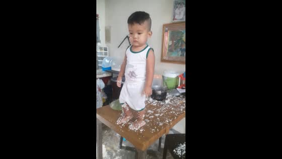 Toddler caught making rice mess on table in Bulacan, Philippines