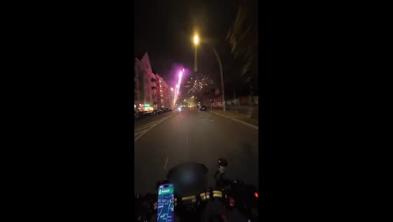 Motorbike ride through fireworks display as New Year 2025 is welcomed in Neukölln, Germany