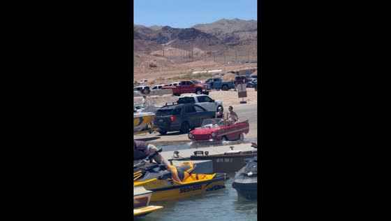 Amphibious convertible car cruises from road into water in Las Vegas, Nevada, USA