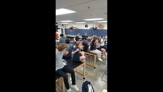 Students demonstrate static electricity with Van de Graaff generator in Tucson, Arizona, USA