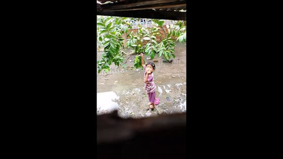 Girl startled by mysterious voice while picking fruit in South Sumatra, Indonesia