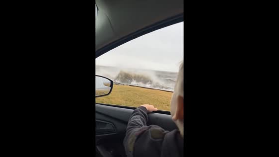 Strong ocean waves splash onto car in New Jersey, USA