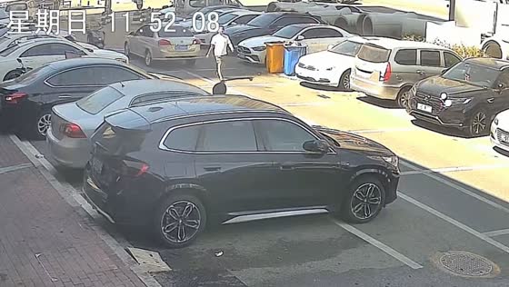 Reversing car strikes pedestrian in parking lot in Shandong, China