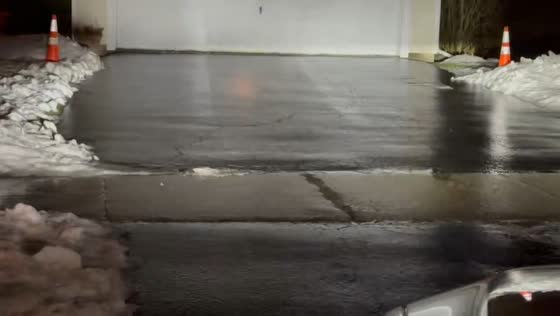 Freezing drizzle coats driveways and roads in Chili, New York, USA