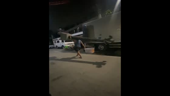 Man lifts entire streetlight pole in Flores, Malabon, Philippines