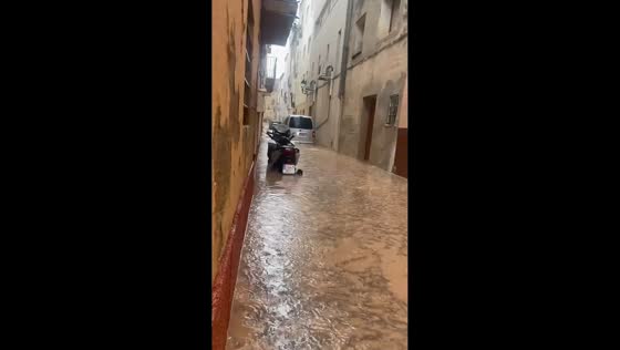 Flash flooding inundates streets and traps vehicles in Xerta, Spain