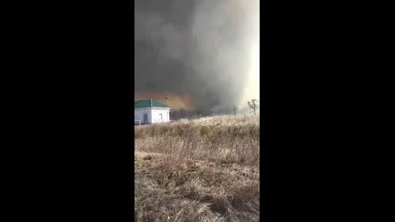Fire tornado menaces homes in Russia
