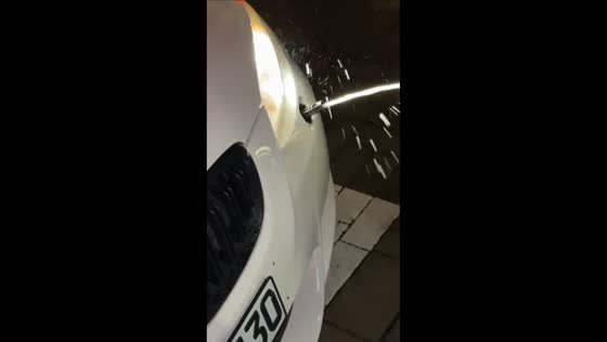 Water spills from BMW tow hook cover in Germany