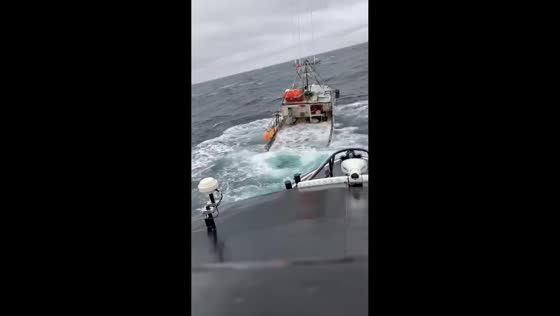 Boat almost sinks in rough seas in Yarmouth, England, UK