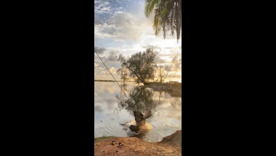 Swing mishap sends two friends into the lake in Muaro Mati, Indonesia
