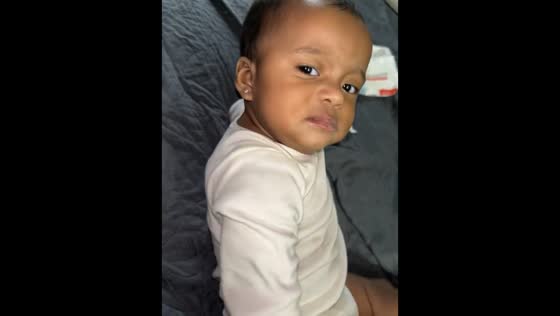 Toddler reacts with attitude to playful flip in Chicago, Illinois, USA