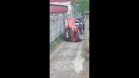 Car tips over while turning into alley in Hebei, China