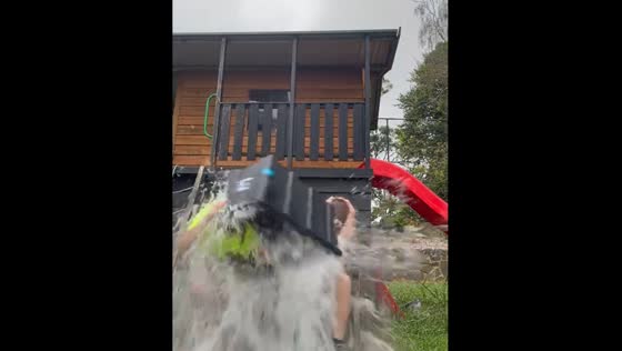 Bucket of water spills after pulling string, Melbourne, Australia