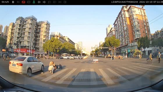 Scooter rider and passenger struck by a car at an intersection in Hubei, China
