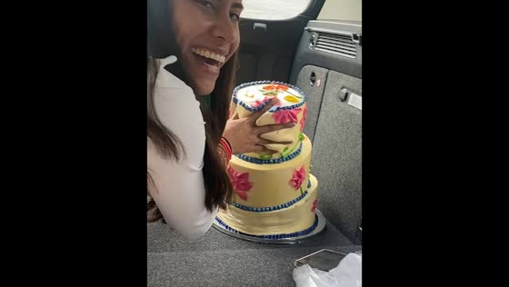 Woman tries to save tilted cake during car ride in Guadalajara, Mexico