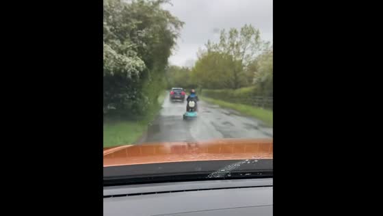 Mobility scooter rider splashed by passing vehicle in Bedford, UK