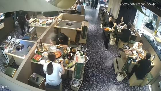 Server slips and spills pot while walking between tables in Jiangsu, China