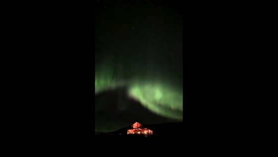 Spectacular northern lights dance across the night sky over Iceland