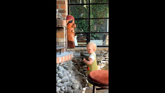 Baby caught acting mischievous near statue in Dundalk, Ireland