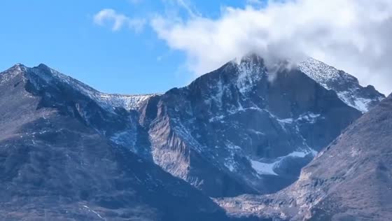 Stunning view of clouds and alpine beauty over Longs Peak, Colorado, USA