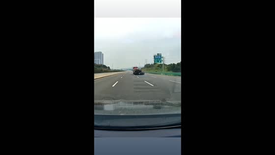Car crashes into the rear of a truck and gets dragged along the highway in Chongqing, China