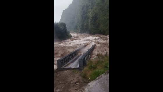 Bridge swept away by flood waters in Tatopani, Nepal