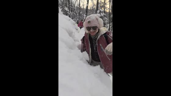 Couple playfully pins each other into deep snow in Jilin, China