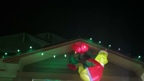 Holiday inflatables battle strong winds in Castle Rock, Colorado, USA