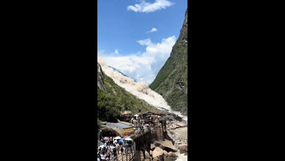 Mountain landslide sends dust and debris into Tiger Leaping Gorge in Shangri-La, Yunnan, China