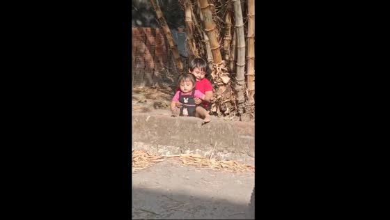 Sibling bond: Bombom guides younger sister Mecil in wall climbing adventure