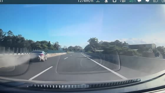 Car loses control and crashes into center barrier before hitting another vehicle in Hainan, China