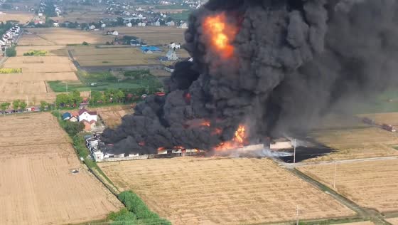 Fire erupts at lubricant factory, sending thick black smoke into the sky in Nantong, Jiangsu, China