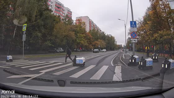Autonomous food delivery robots cross busy intersection in Moscow, Russia